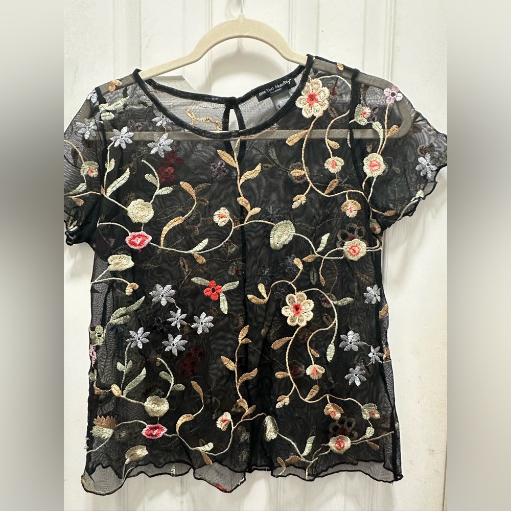 Black mesh short-sleeved top with floral embroidery. Size L from See You Monday